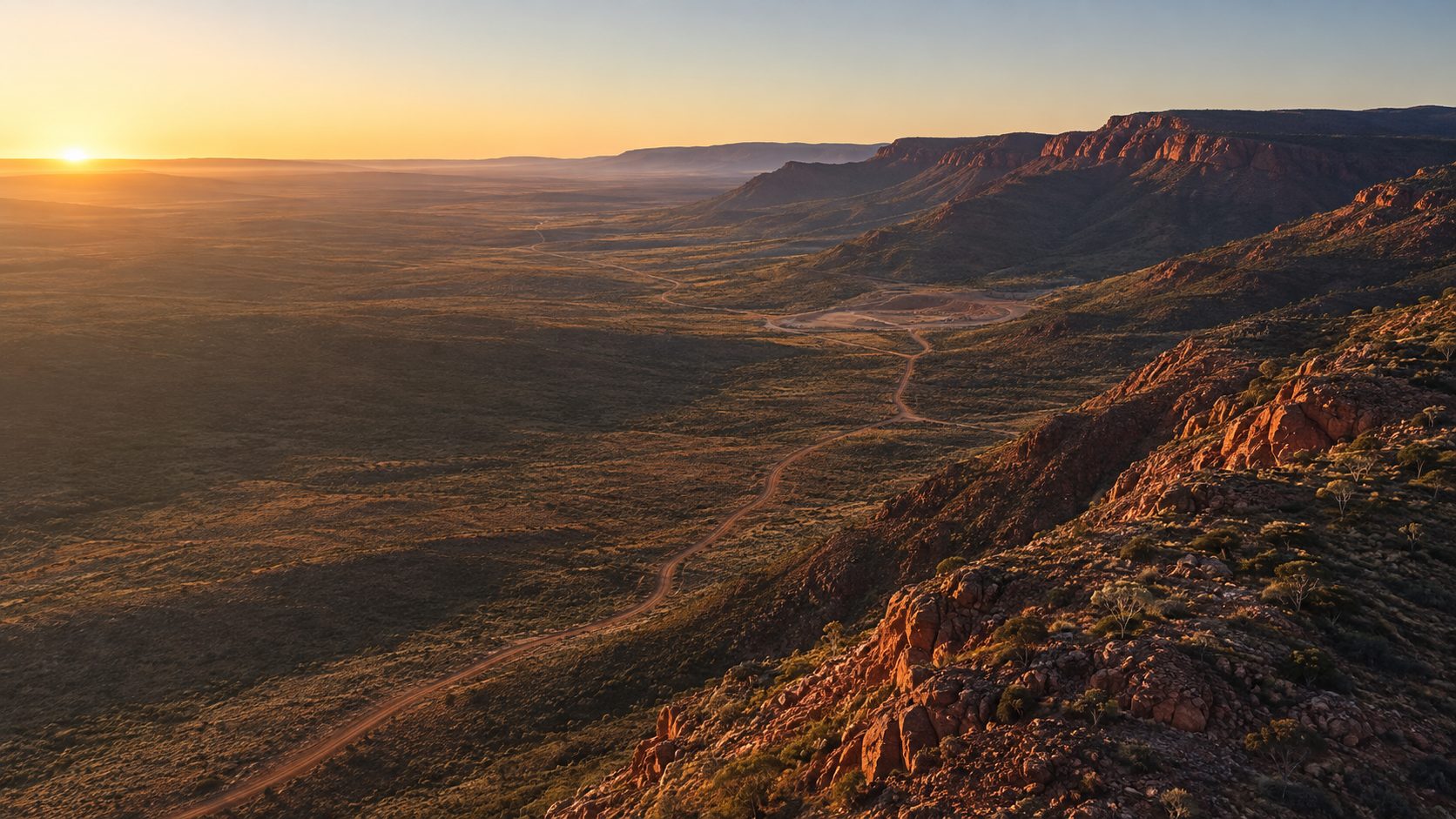 Escarpment country at sunset, looking across an eroded valley in the Queensland resource basins.